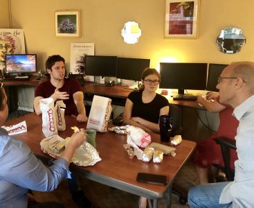 TCJE staff and interns meet in the office